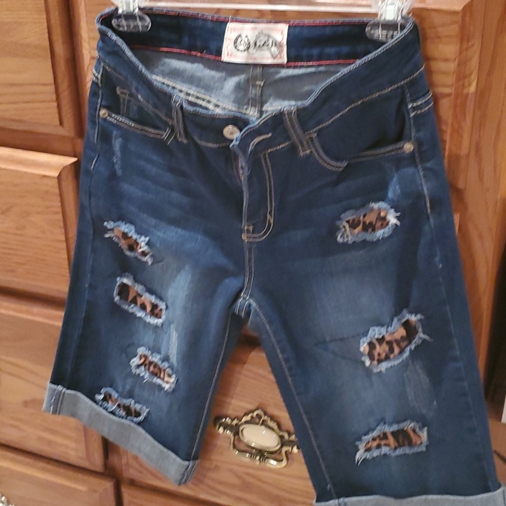 L & B distressed animal print denim shorts
